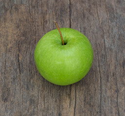 Green Apple on wood background