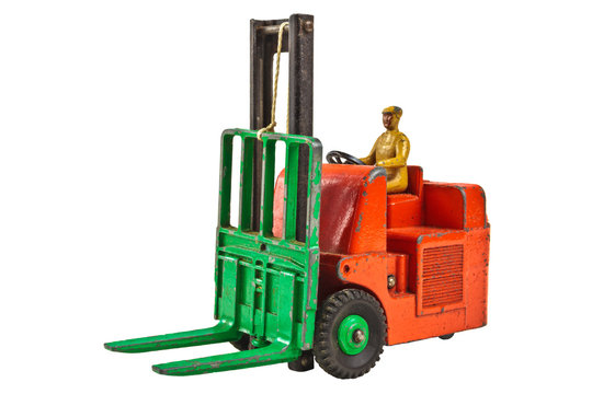 Vintage toy fork lift truck isolated on white