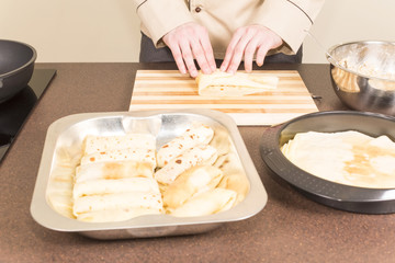 cook prepares empanadas