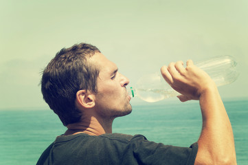 man drinking water