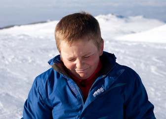 Boy in the snow mountain