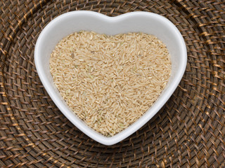 Brown rice in a heart shaped bowl