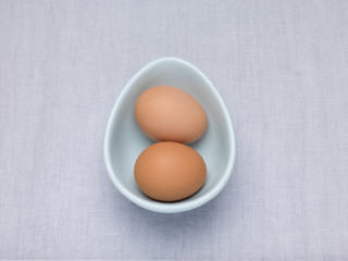 Two Eggs in an oval egg shaped bowl