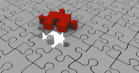3D Puzzle in grau mit rotem entnommenem Teil