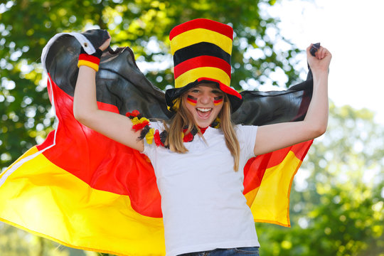 german soccer fan waving her flag