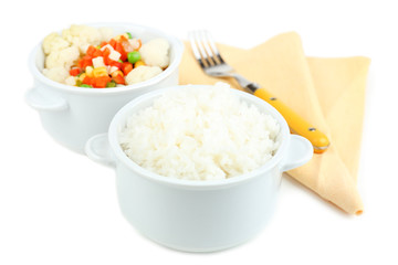 Cooked rice and vegetables isolated on white