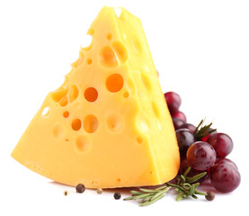 Piece of cheese with grape and rosemary, isolated on white