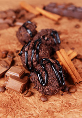 Delicious chocolates on table close-up