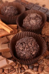 Delicious chocolates on table close-up