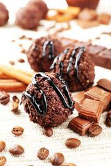 Delicious chocolates on table close-up