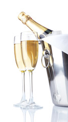Glasses of champagne and bottle in pail, isolated on white