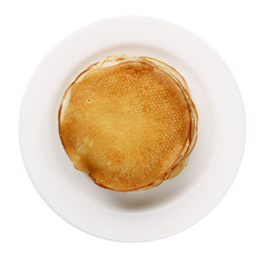 yellow pancakes on a white plate isolated