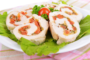 Delicious chicken roll on plate on table close-up