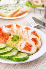 Delicious chicken roll on plate on table close-up