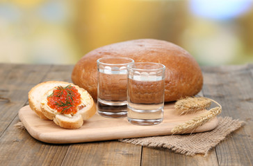 Composition with glasses of vodka  bread and red caviar