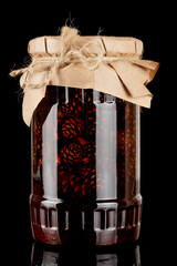 Glass jar with pine cones preserves