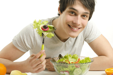 Man eating organic healty salad for perfect diet. Green for life
