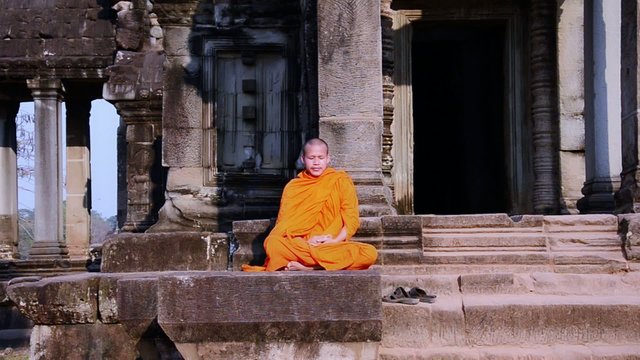 cambodian monk in angkor wat temple