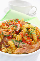 Fried pasta with pork ham and paprika