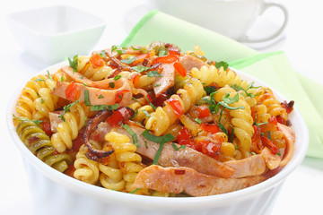 Fried pasta with pork ham and paprika