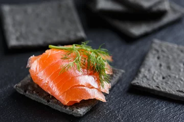 Foto op Plexiglas Smoked Salmon on black cracker © anna.q