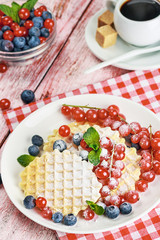waffles with berries on the table