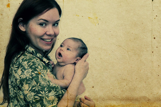 young mother with her baby. Photo in old image style