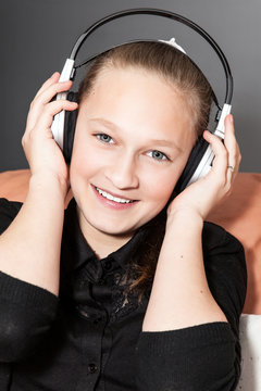 Happy girl singing with headphones