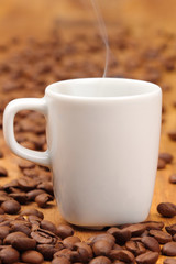 a cup of espresso with coffee beans