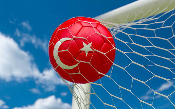 Turkey flag and soccer ball in goal net