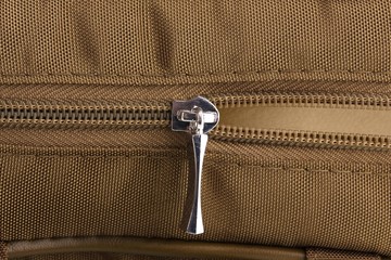 Half-opened bag's zipper close up © Africa Studio
