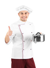 Professional chef in white uniform and hat, holding pan in his