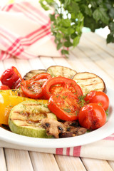 Delicious grilled vegetables on plate on table close-up