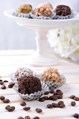 Set of chocolate candies on table on light background