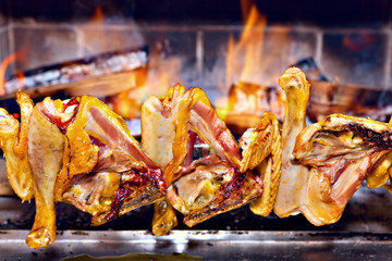 Chicken roasting on skewer