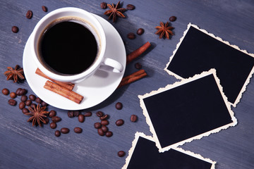 Coffee cup and old blank photos and spices, on wooden