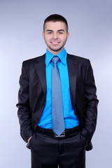 Business man on grey background