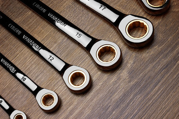Set of wrenches on wood