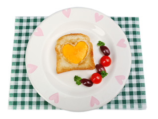 Scrambled eggs with bread on plate, on color napkin