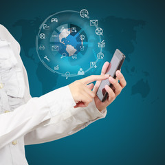 Businessman showing smartphone with globe and icon application o