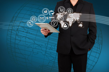 Businessman showing map and icon application on virtual screen.