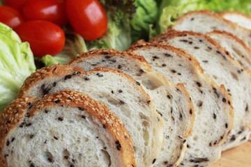 bread sprinkled with sesame -  vegetable green salad