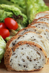 bread sprinkled with sesame -  vegetable green salad