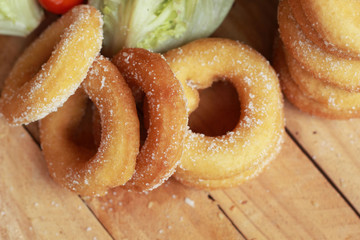 donut and sugar - fresh vegetable salad.