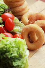 donut and sugar - fresh vegetable salad.