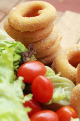 donut and sugar - fresh vegetable salad.