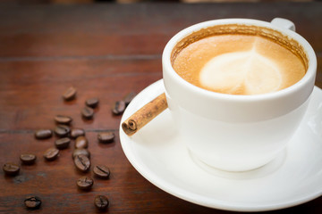 Coffee cup with cinnamon stick