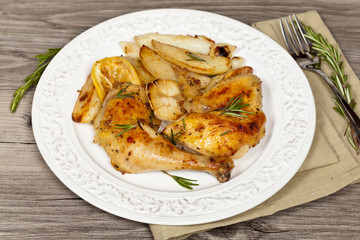 Chicken with Garlic, and Rosemary with potato. Selective focus.