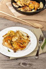 Roasted chicken thighs with Rosemary. Selective focus.
