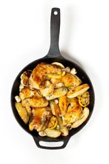 Roasted Chicken on Frying Pan with potato. Selective focus.